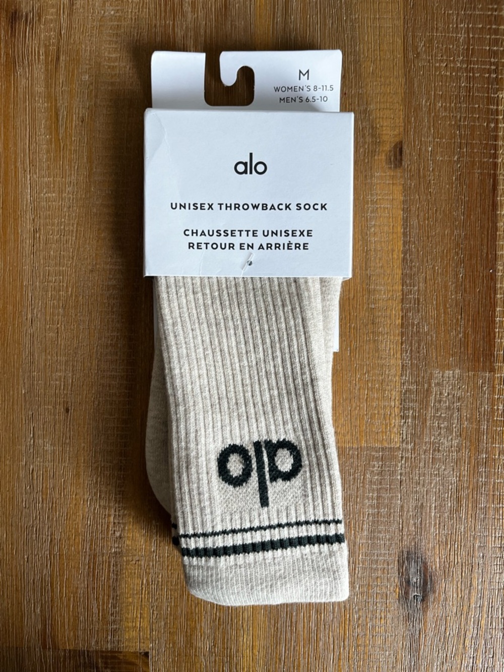 ALO Yoga Unisex Throwback Ribbed Socks in Cream with Black Logo